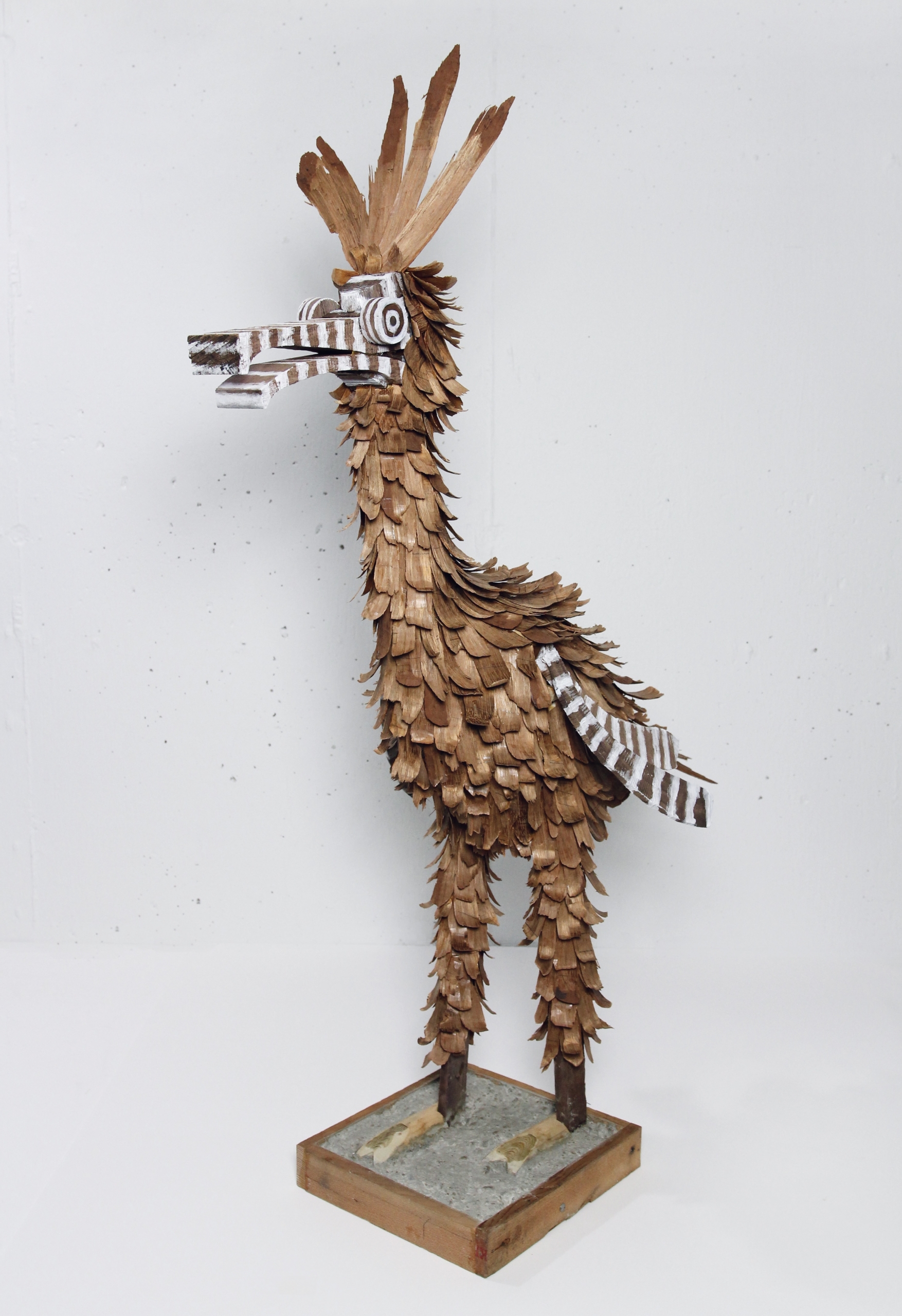 Bird no 3, 2021, various woods, nails, PVA glue, concrete, acrylic paint, 38 x 14 x 30 in