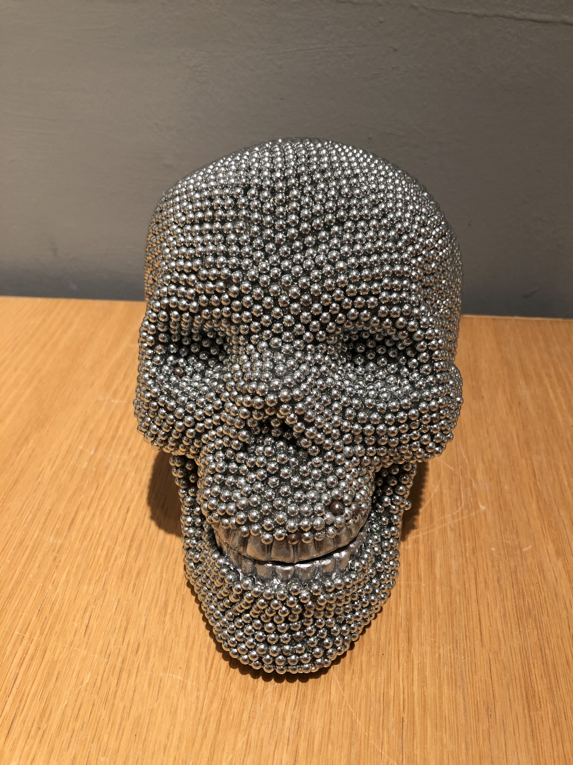 Timmermans, Skull (silver), 2015, air rifle BBs, cast resin, mixed media, 6x6x8in. 5